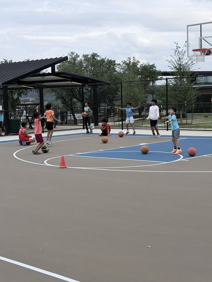 Kids practicing dribbling drills