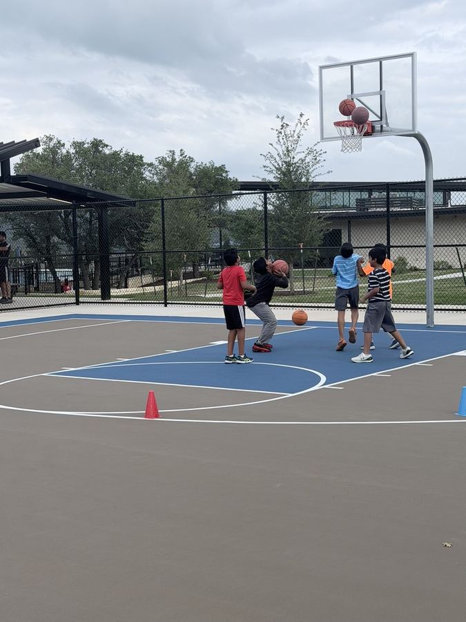 Kids shooting baskets
